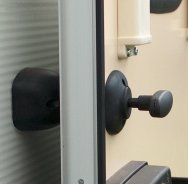 QUICK RELEASE BARREL DOOR RETAINER In Black or White